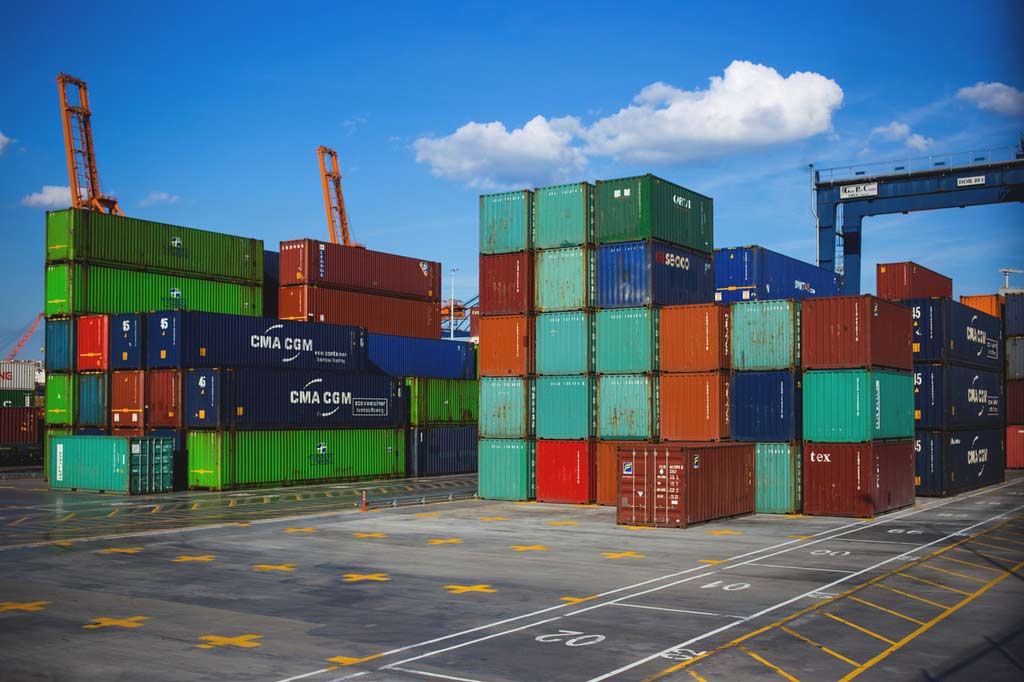 Blue, green and red containers on a ship