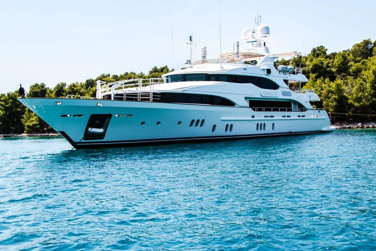 a luxury yacht floats on the water